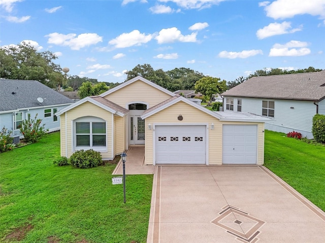 1142 W Boone Ct, The Villages, FL 32159 - view of front facade featuring a front yard, concrete driveway, and an attached garage