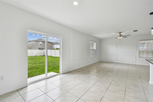 2139 Stellar Brilliance Way, Lutz, FL 33558 - unfurnished room with healthy amount of natural light, ceiling fan, and light tile patterned floors