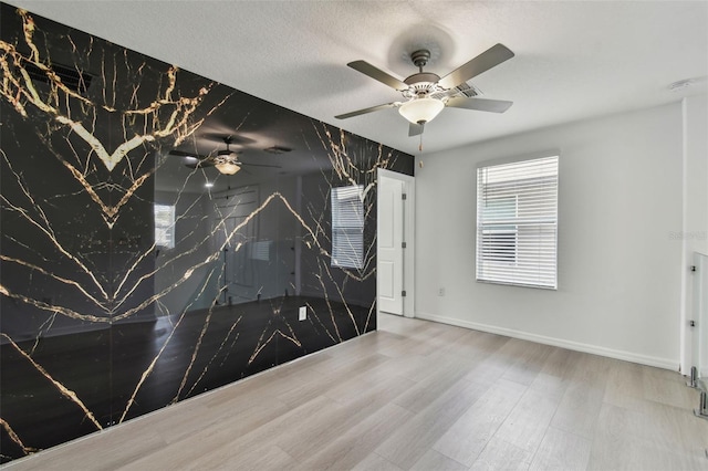 2139 Stellar Brilliance Way, Lutz, FL 33558 - unfurnished room with a ceiling fan, wood finished floors, and a smoke detector