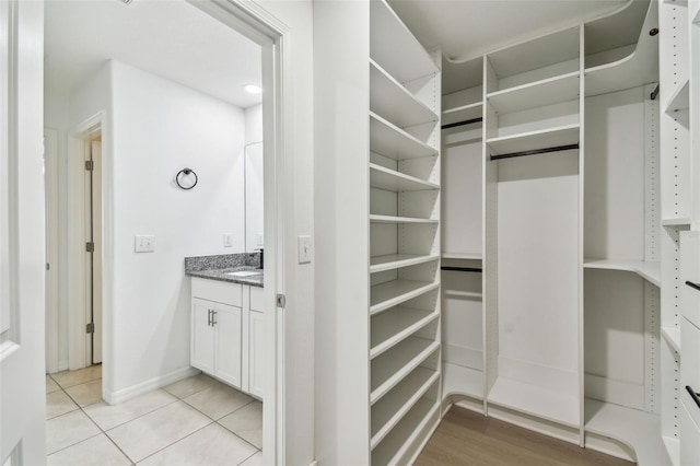 2139 Stellar Brilliance Way, Lutz, FL 33558 - spacious closet with light tile patterned floors and a sink