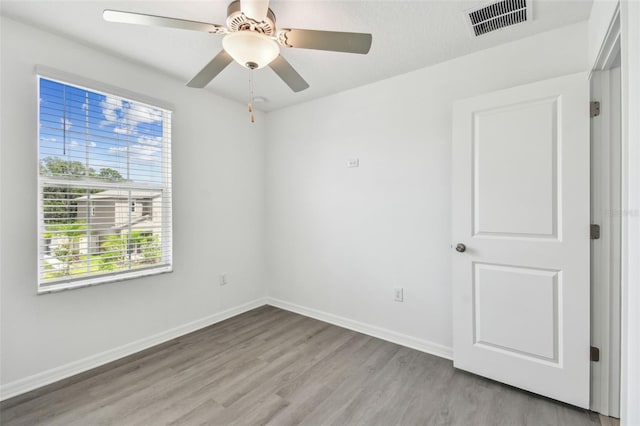 2139 Stellar Brilliance Way, Lutz, FL 33558 - spare room with light wood-style floors and ceiling fan