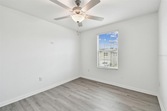 2139 Stellar Brilliance Way, Lutz, FL 33558 - empty room featuring wood finished floors and ceiling fan