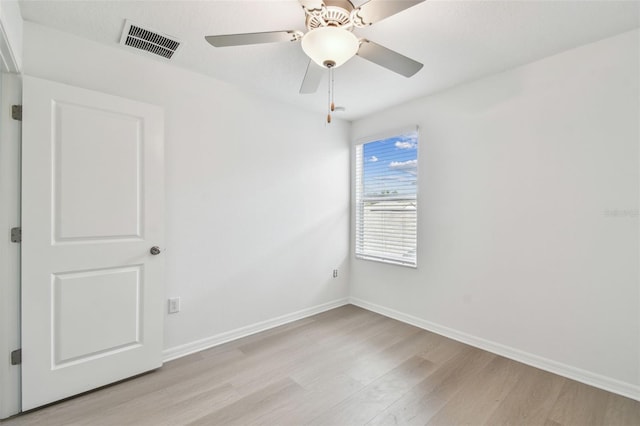 2139 Stellar Brilliance Way, Lutz, FL 33558 - unfurnished room with light wood finished floors and a ceiling fan