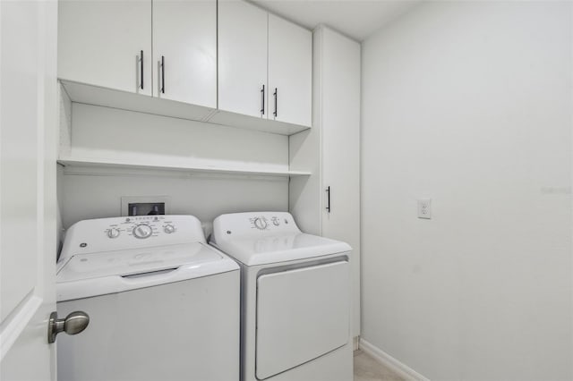 2139 Stellar Brilliance Way, Lutz, FL 33558 - laundry area featuring washing machine and clothes dryer and cabinet space