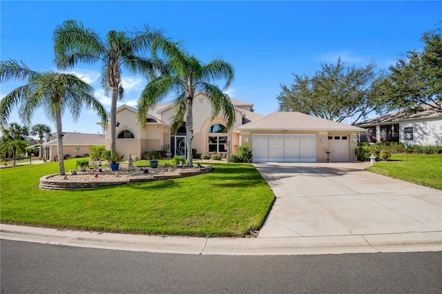 5740 Bounty Cir, Tavares, FL 32778 - view of front of home with a garage, driveway, a front yard, and stucco siding
