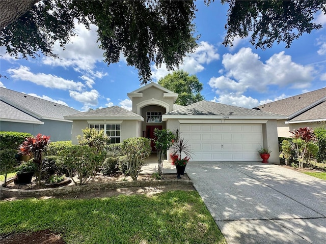 15509 Markham Dr, Clermont, FL 34714 - ranch-style house with stucco siding, an attached garage, and driveway
