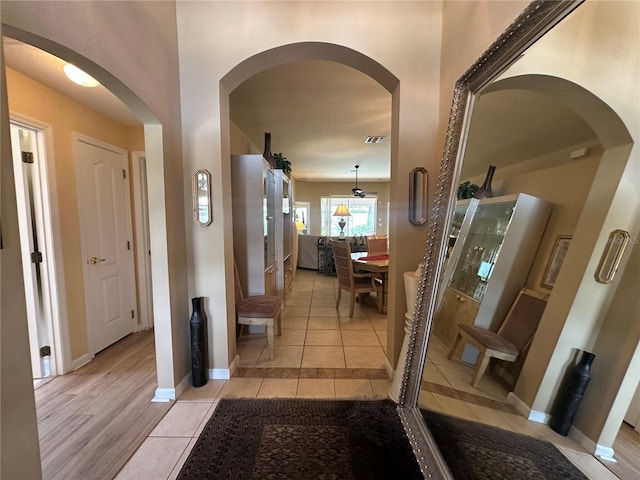 15509 Markham Dr, Clermont, FL 34714 - corridor featuring light tile patterned flooring and baseboards