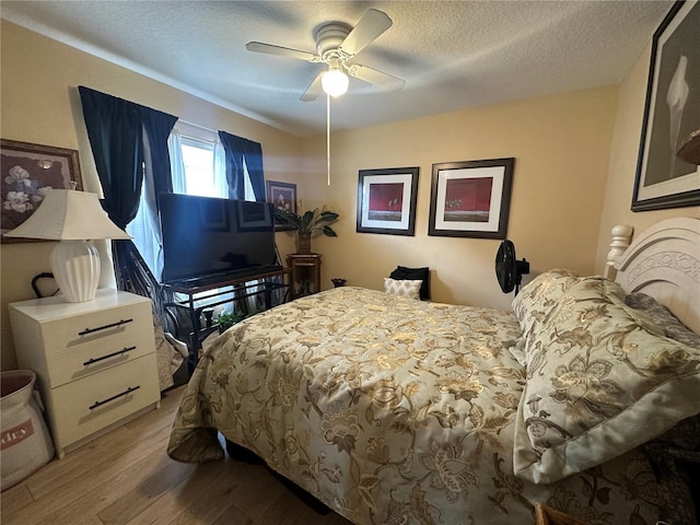 15509 Markham Dr, Clermont, FL 34714 - bedroom featuring wood finished floors, a textured ceiling, and ceiling fan