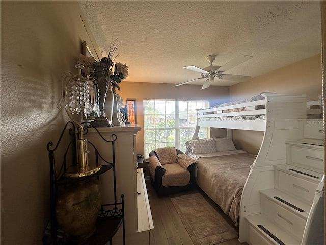 15509 Markham Dr, Clermont, FL 34714 - bedroom featuring wood finished floors, a textured ceiling, and ceiling fan