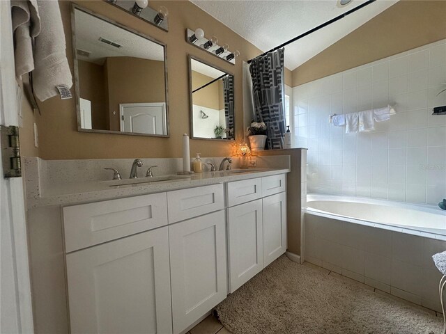 15509 Markham Dr, Clermont, FL 34714 - bathroom with lofted ceiling and double vanity