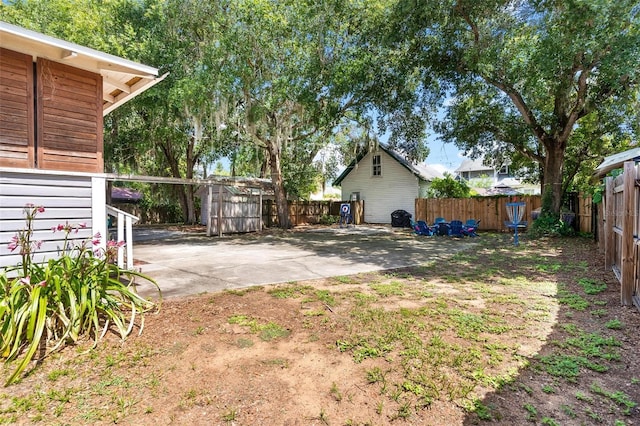 501 Washington Ave, Eustis, FL 32726 - fenced backyard with a patio