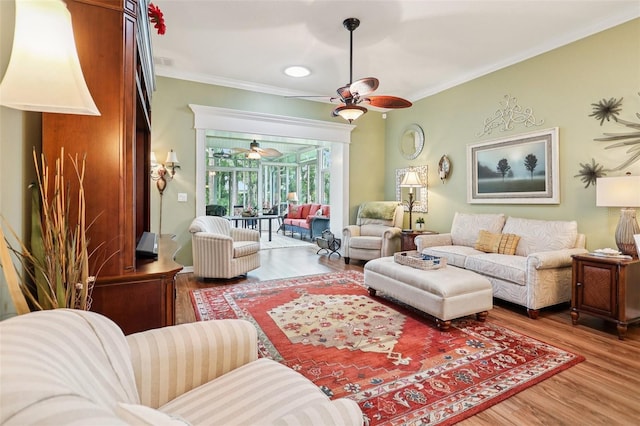 2512 Baywater Rd, Tavares, FL 32778 - living room with ceiling fan, wood finished floors, and crown molding