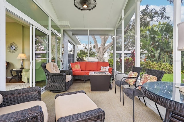 2512 Baywater Rd, Tavares, FL 32778 - sunroom / solarium featuring an outdoor living space with a fire pit and a ceiling fan