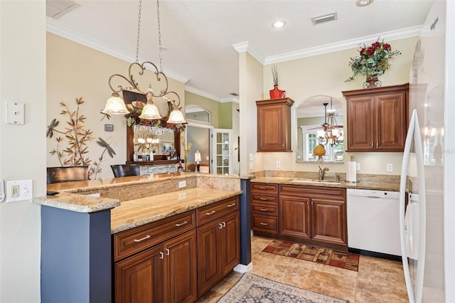 2512 Baywater Rd, Tavares, FL 32778 - kitchen featuring white appliances, a chandelier, crown molding, a peninsula, and light stone counters