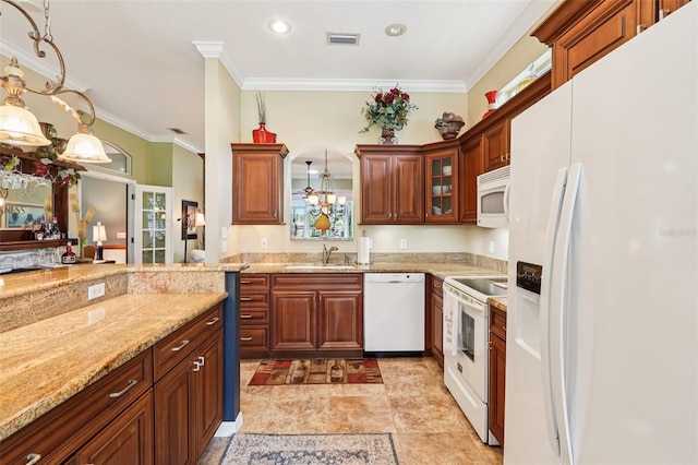 2512 Baywater Rd, Tavares, FL 32778 - kitchen with white appliances, crown molding, light stone countertops, decorative light fixtures, and a chandelier