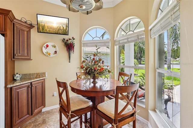 2512 Baywater Rd, Tavares, FL 32778 - dining area featuring baseboards and light tile patterned floors