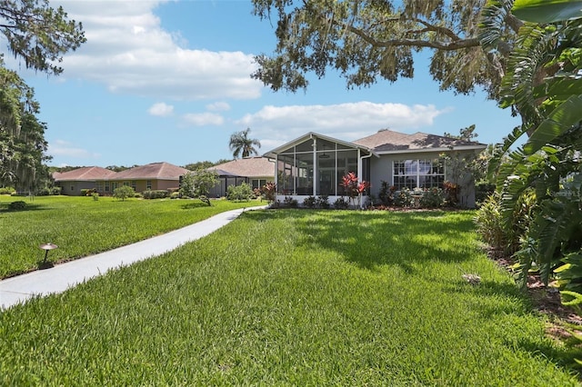 2512 Baywater Rd, Tavares, FL 32778 - view of green lawn with a sunroom