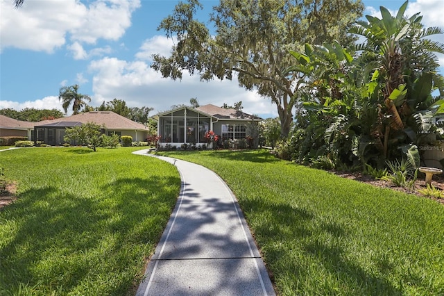 2512 Baywater Rd, Tavares, FL 32778 - view of green lawn featuring a sunroom