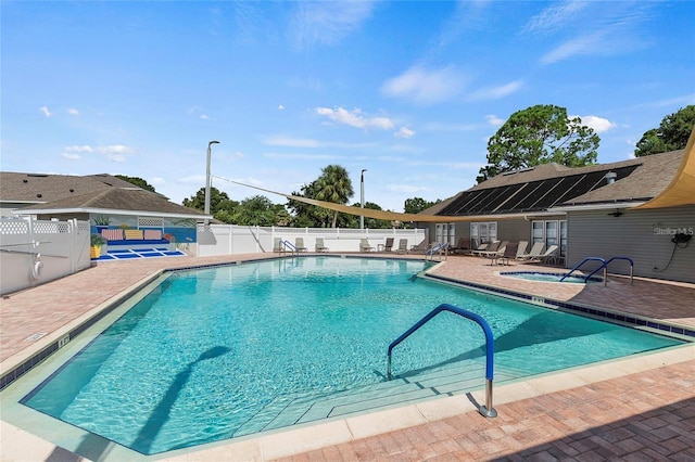 2512 Baywater Rd, Tavares, FL 32778 - community pool with a patio, a fenced backyard, and a community hot tub