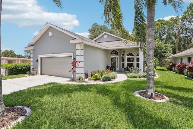 2512 Baywater Rd, Tavares, FL 32778 - ranch-style home featuring stucco siding, a garage, concrete driveway, and a front yard