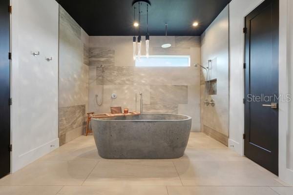 10711 County Road 561, Clermont, FL 34711 - bathroom with a freestanding tub, tile patterned flooring, and a shower