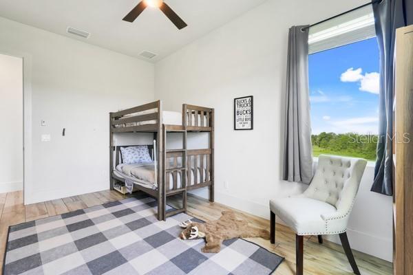 10711 County Road 561, Clermont, FL 34711 - bedroom with light wood-style floors