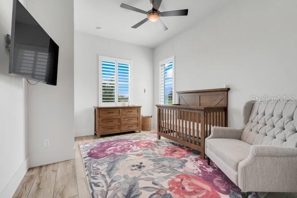 10711 County Road 561, Clermont, FL 34711 - bedroom featuring light wood-style flooring and ceiling fan