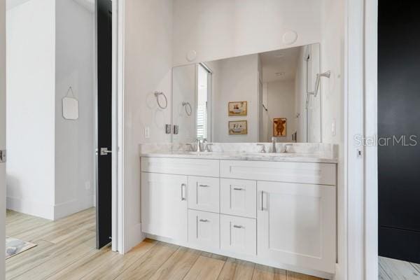 10711 County Road 561, Clermont, FL 34711 - full bath featuring double vanity and wood finished floors