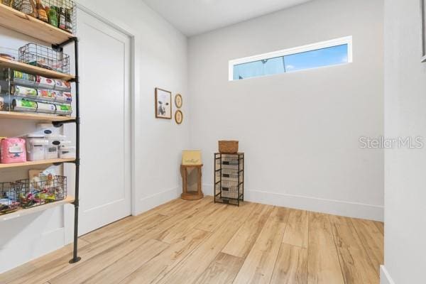 10711 County Road 561, Clermont, FL 34711 - empty room featuring wood finished floors and baseboards