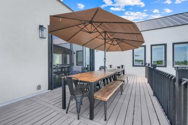10711 County Road 561, Clermont, FL 34711 - wooden deck featuring outdoor dining area