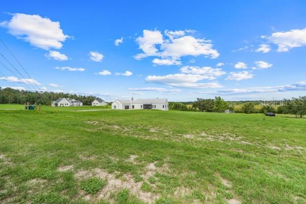 10711 County Road 561, Clermont, FL 34711 - view of green lawn featuring a view of countryside
