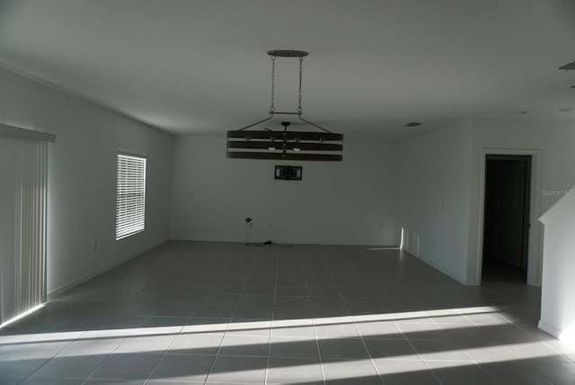 1138 Calico Pointe Cir, Groveland, FL 34736 - tiled empty room featuring baseboards