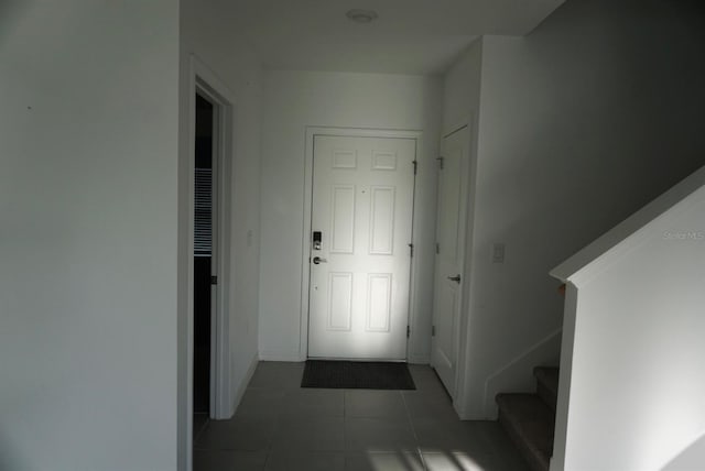1138 Calico Pointe Cir, Groveland, FL 34736 - hallway with tile patterned floors and stairs
