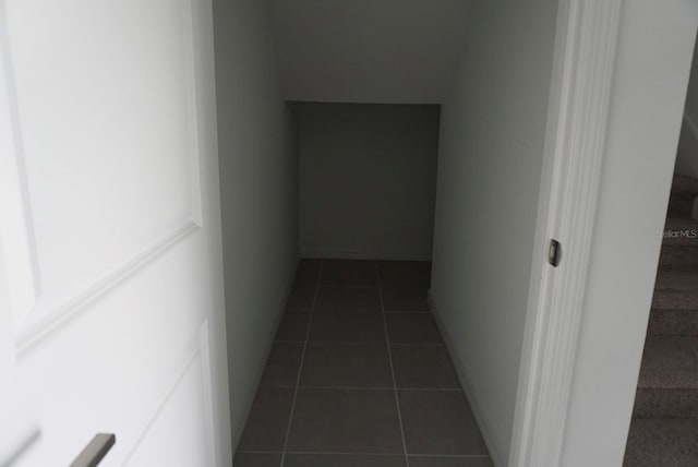 1138 Calico Pointe Cir, Groveland, FL 34736 - hallway with dark tile patterned floors and stairway
