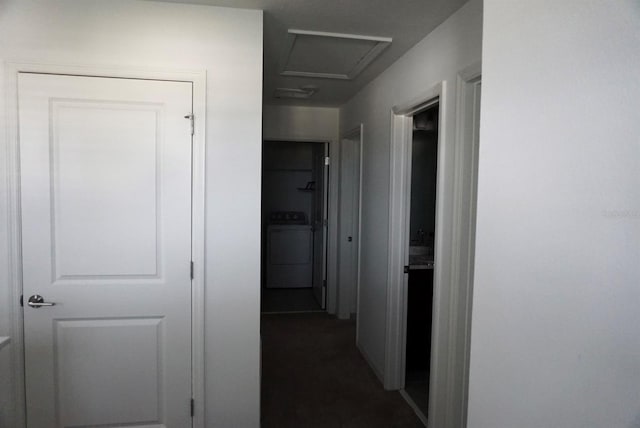 1138 Calico Pointe Cir, Groveland, FL 34736 - hallway with washer / clothes dryer, attic access, and dark carpet