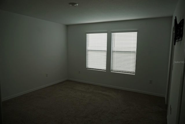 1138 Calico Pointe Cir, Groveland, FL 34736 - carpeted empty room with baseboards