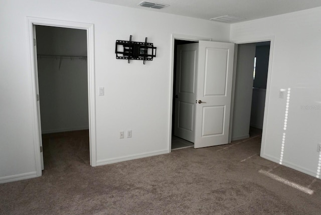 1138 Calico Pointe Cir, Groveland, FL 34736 - unfurnished bedroom with carpet, a walk in closet, and a closet