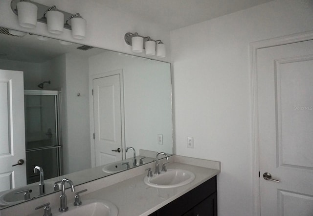 1138 Calico Pointe Cir, Groveland, FL 34736 - bathroom with double vanity and a shower stall