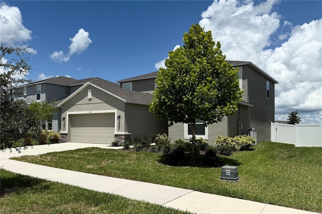 1138 Calico Pointe Cir, Groveland, FL 34736 - view of front of house with a garage, stucco siding, and concrete driveway