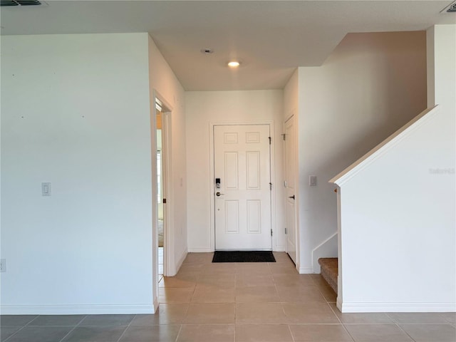 1138 Calico Pointe Cir, Groveland, FL 34736 - foyer featuring tile patterned flooring, stairs, and recessed lighting