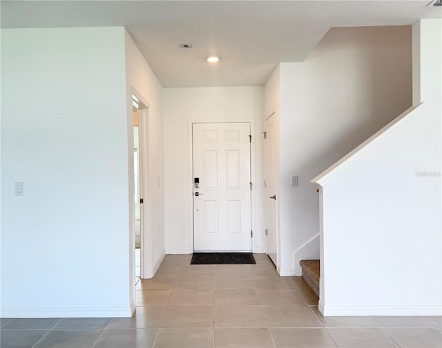 1138 Calico Pointe Cir, Groveland, FL 34736 - foyer with stairs and tile patterned flooring