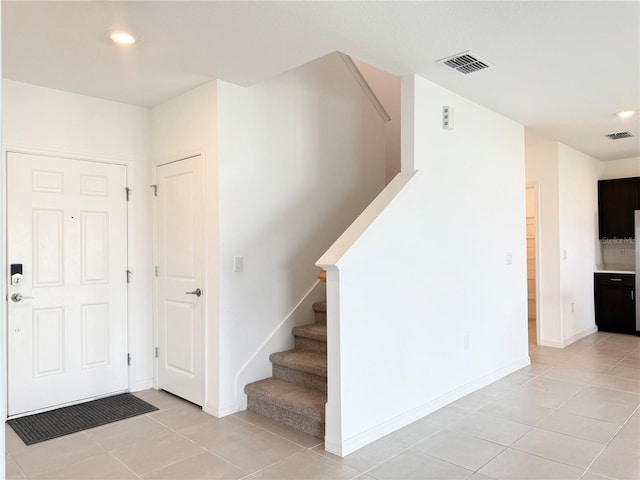 1138 Calico Pointe Cir, Groveland, FL 34736 - foyer with stairway, light tile patterned floors, and recessed lighting