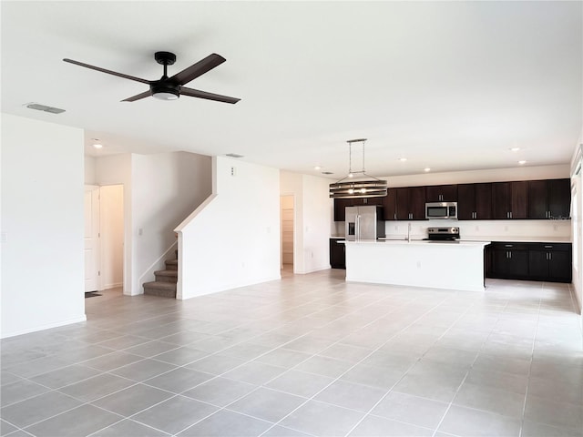 1138 Calico Pointe Cir, Groveland, FL 34736 - unfurnished living room featuring light tile patterned flooring, recessed lighting, stairway, and a ceiling fan