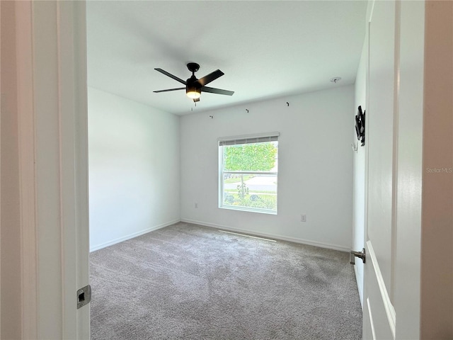 1138 Calico Pointe Cir, Groveland, FL 34736 - spare room featuring carpet flooring and a ceiling fan