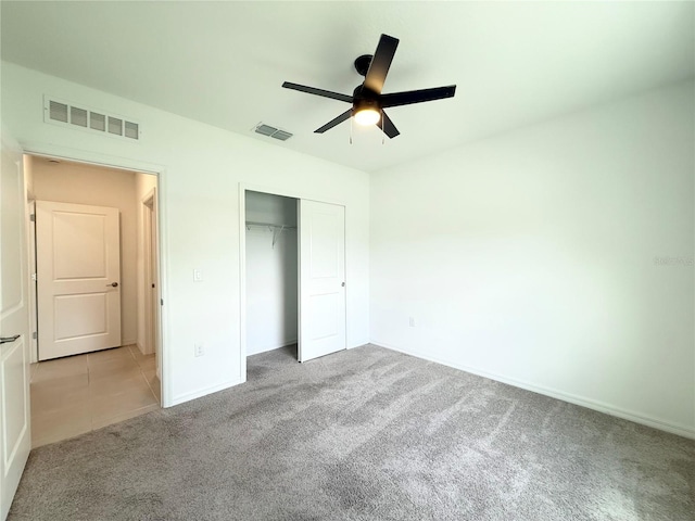 1138 Calico Pointe Cir, Groveland, FL 34736 - unfurnished bedroom featuring carpet floors, a closet, and ceiling fan