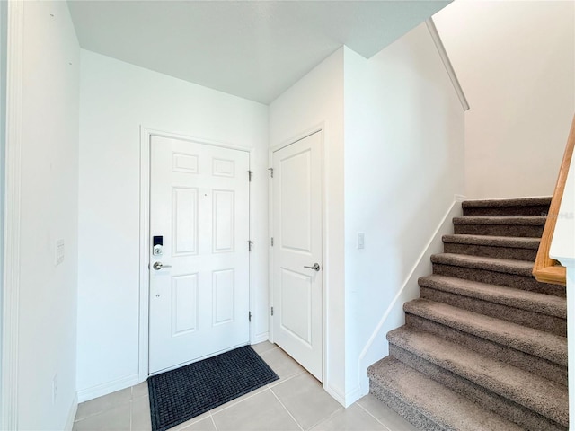 1138 Calico Pointe Cir, Groveland, FL 34736 - foyer entrance featuring stairway and light tile patterned floors