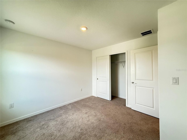 1138 Calico Pointe Cir, Groveland, FL 34736 - unfurnished bedroom with carpet flooring, a closet, and recessed lighting