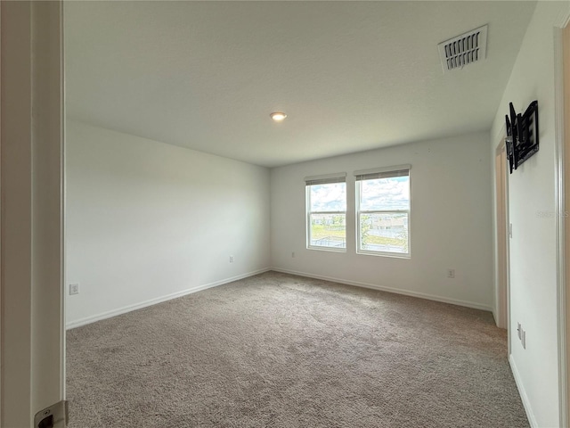 1138 Calico Pointe Cir, Groveland, FL 34736 - carpeted spare room featuring baseboards and recessed lighting