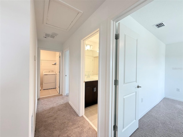1138 Calico Pointe Cir, Groveland, FL 34736 - hall featuring washer / dryer and light carpet