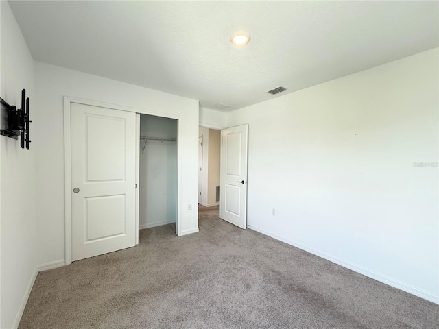 1138 Calico Pointe Cir, Groveland, FL 34736 - unfurnished bedroom with carpet floors and a closet